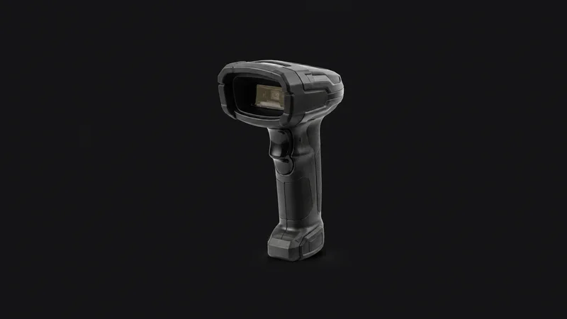 Isolated a rugged handheld barcode scanner with a pistol grip centred on a seamless deep charcoal near-black studio background, generous empty margin on every side for overlaid branding