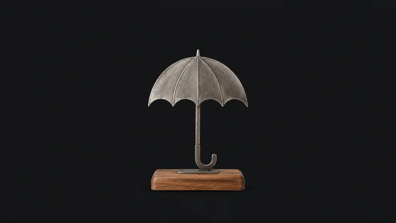 Isolated a cast-metal umbrella emblem on a wooden base centred on a seamless deep charcoal near-black studio background, generous empty margin on every side for overlaid branding