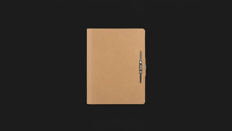 Isolated a blank cardboard candidate folder with a metal fastener centred on a seamless deep charcoal near-black studio background, generous empty margin on every side for overlaid branding