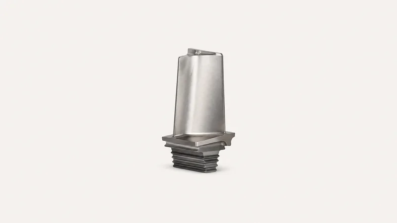 Isolated a machined titanium turbine-blade blank with a fir-tree root centred on a seamless pale off-white studio background, generous empty margin on every side for overlaid branding