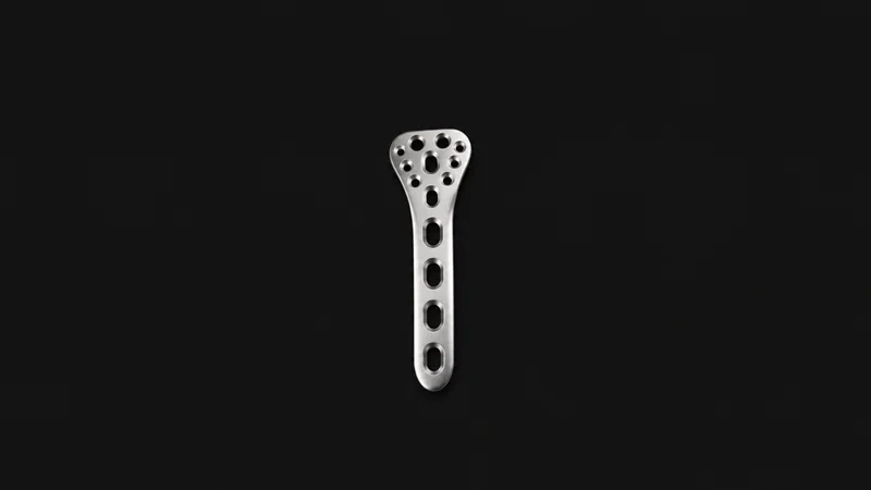 Isolated a stainless orthopaedic bone plate with screw holes centred on a seamless deep charcoal near-black studio background, generous empty margin on every side for overlaid branding