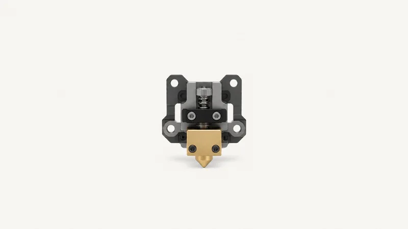 Isolated a brass hot-end nozzle and heater block on a bare extruder carriage centred on a seamless pale off-white studio background, generous empty margin on every side for overlaid branding