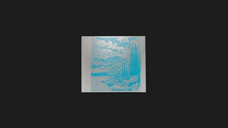 Isolated an aluminium offset printing plate with an etched cyan separation centred on a seamless deep charcoal near-black studio background, generous empty margin on every side for overlaid branding