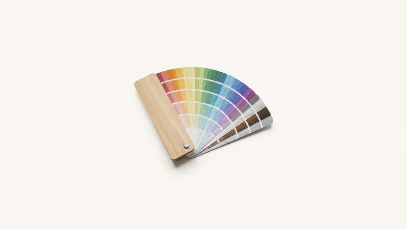 Isolated a wooden artist's pantone-style colour fan deck centred on a seamless pale off-white studio background, generous empty margin on every side for overlaid branding