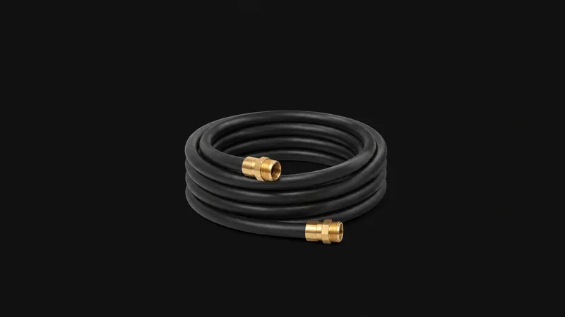 Isolated a coiled liquid-cooling tube with brass fittings centred on a seamless deep charcoal near-black studio background, generous empty margin on every side for overlaid branding