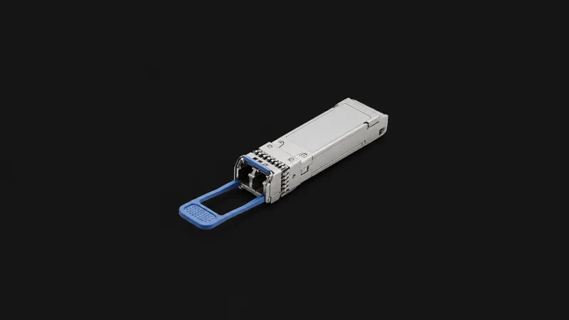 Isolated a transceiver module with a pull tab centred on a seamless deep charcoal near-black studio background, generous empty margin on every side for overlaid branding