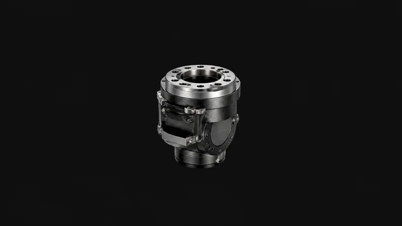 Isolated a six-axis robot wrist with a bare mounting flange centred on a seamless deep charcoal near-black studio background, generous empty margin on every side for overlaid branding