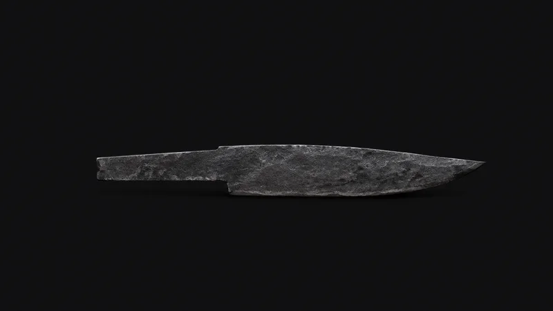 Isolated a rough-forged carbon-steel blade blank with hammer-scale still on it centred on a seamless deep charcoal near-black studio background, generous empty margin on every side for overlaid branding