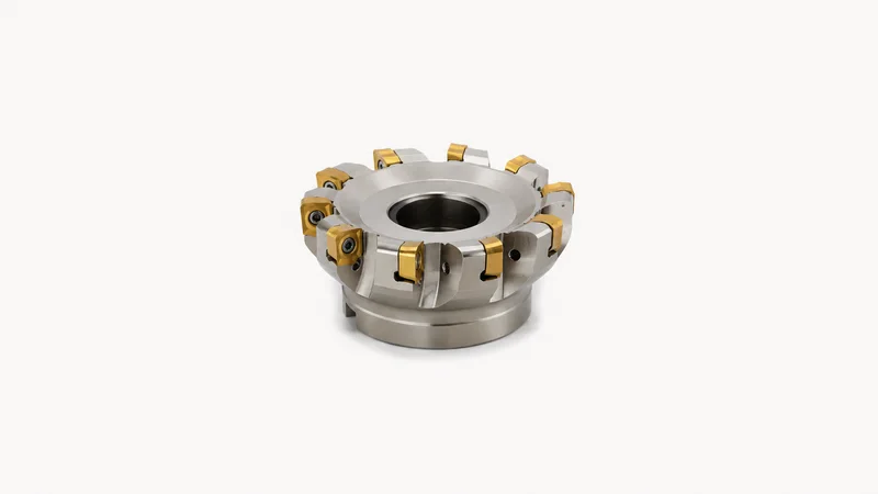 Isolated a carbide-insert face-milling cutter with a dozen gold-coated inserts centred on a seamless pale off-white studio background, generous empty margin on every side for overlaid branding