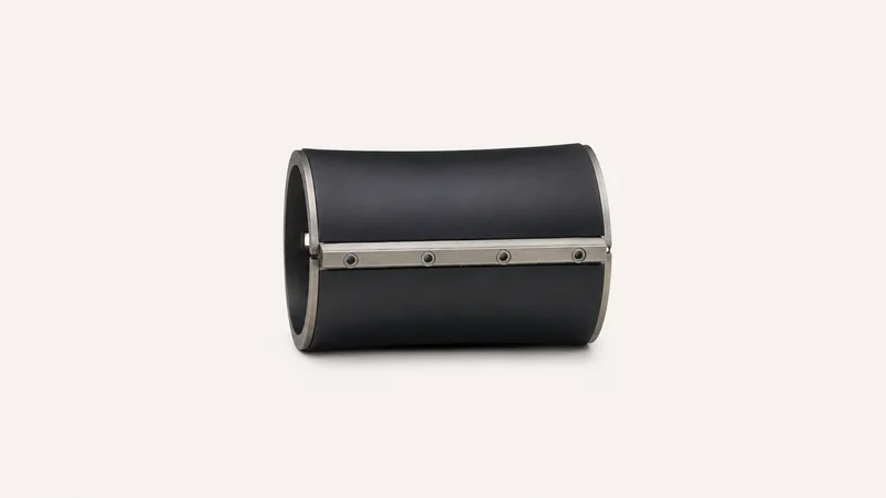 Isolated a rubber offset blanket cylinder section with its clamp bar centred on a seamless pale off-white studio background, generous empty margin on every side for overlaid branding