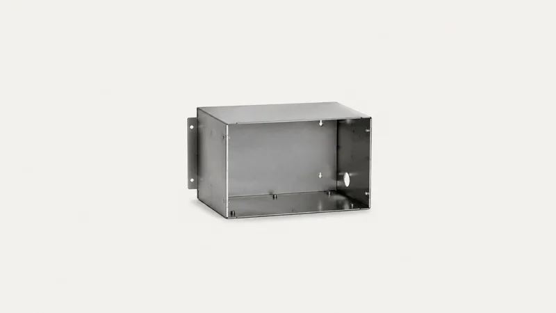 Isolated a press-braked sheet-steel enclosure with folded flanges centred on a seamless pale off-white studio background, generous empty margin on every side for overlaid branding