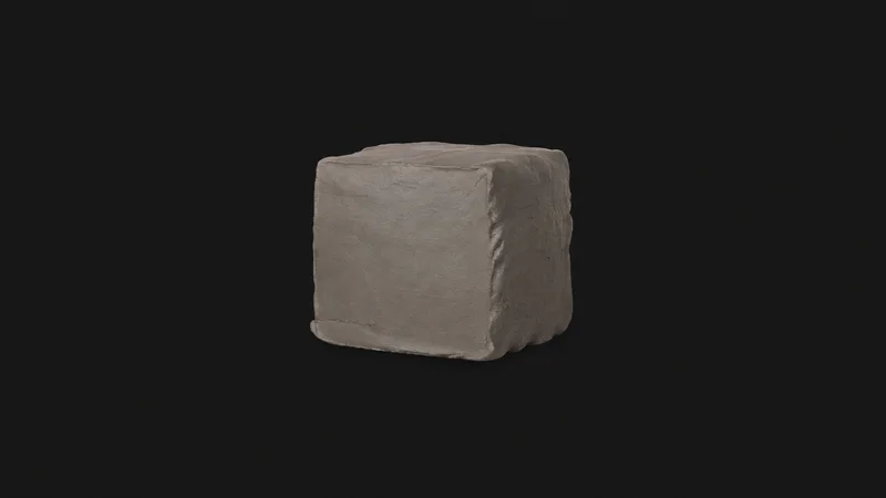 Isolated a wire-cut block of grey stoneware clay centred on a seamless deep charcoal near-black studio background, generous empty margin on every side for overlaid branding