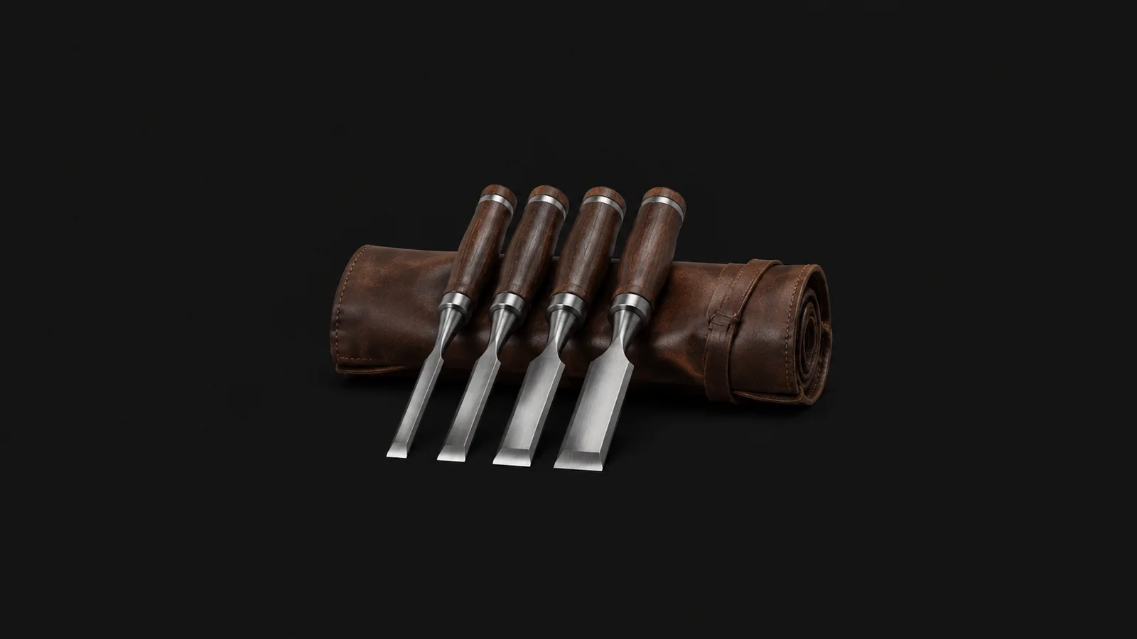Isolated a set of bevel-edged chisels on a leather roll centred on a seamless deep charcoal near-black studio background, generous empty margin on every side for overlaid branding