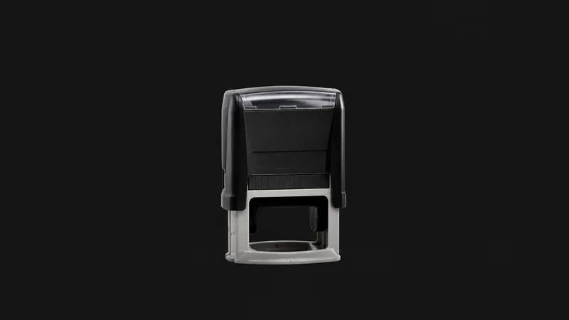 Isolated a self-inking notary stamp standing on its rubber base centred on a seamless deep charcoal near-black studio background, generous empty margin on every side for overlaid branding