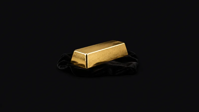 Isolated a gold-plated ingot resting on a black velvet cloth centred on a seamless deep charcoal near-black studio background, generous empty margin on every side for overlaid branding