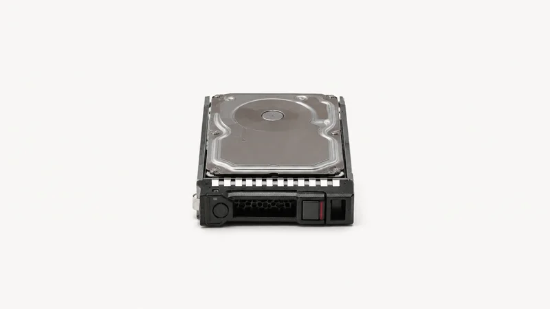 Isolated a hot-swap drive caddy holding an enterprise hard disk centred on a seamless pale off-white studio background, generous empty margin on every side for overlaid branding