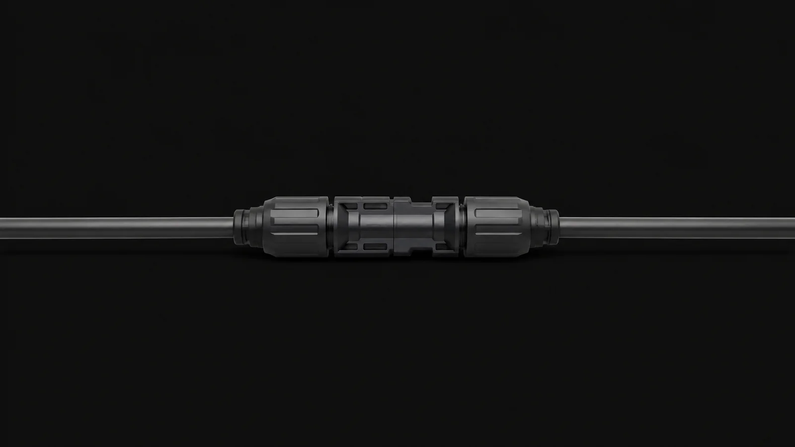 Isolated a pair of mated MC4 connectors on a length of cable centred on a seamless deep charcoal near-black studio background, generous empty margin on every side for overlaid branding