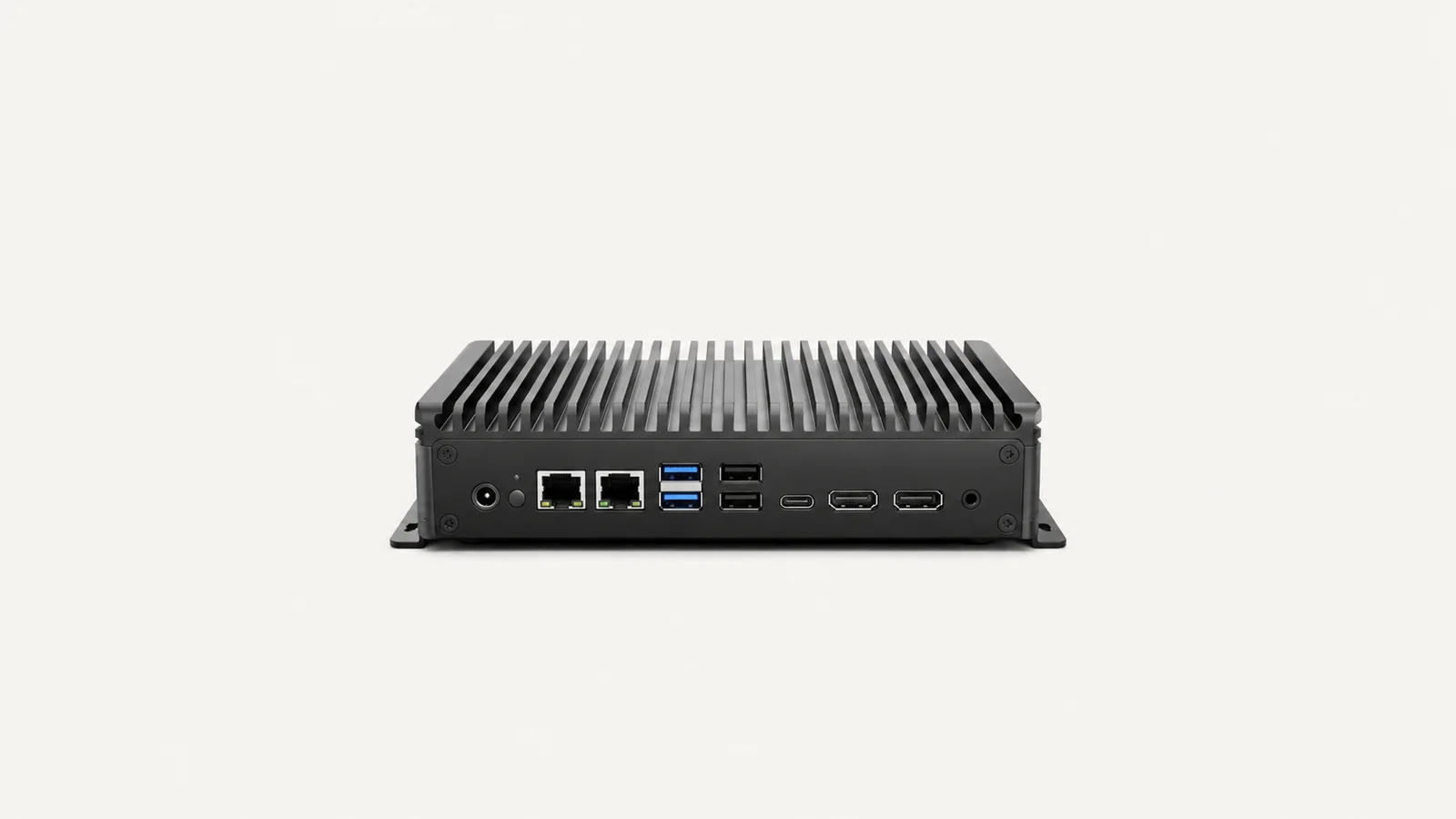 Isolated a fanless edge computer with finned heatsink housing centred on a seamless pale off-white studio background, generous empty margin on every side for overlaid branding