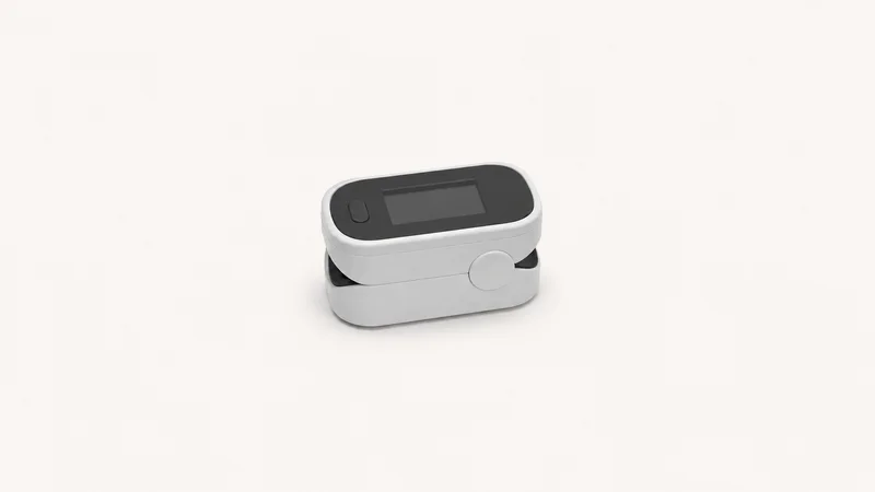 Isolated a fingertip pulse oximeter clip with a blank readout window centred on a seamless pale off-white studio background, generous empty margin on every side for overlaid branding