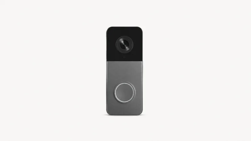 Isolated a video doorbell unit with a round lens and a blank button ring centred on a seamless pale off-white studio background, generous empty margin on every side for overlaid branding