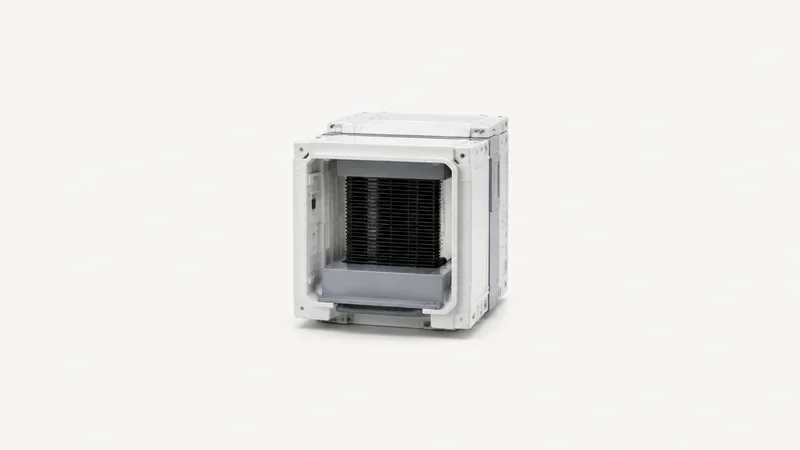 Isolated a front-opening wafer pod with its door removed centred on a seamless pale off-white studio background, generous empty margin on every side for overlaid branding
