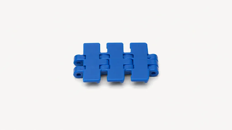 Isolated a plastic modular conveyor chain link in blue acetal centred on a seamless pale off-white studio background, generous empty margin on every side for overlaid branding