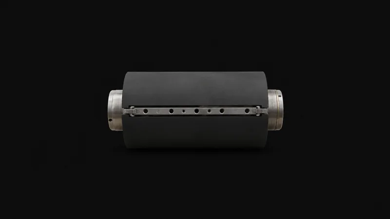 Isolated a rubber offset blanket cylinder section with its clamp bar centred on a seamless deep charcoal near-black studio background, generous empty margin on every side for overlaid branding