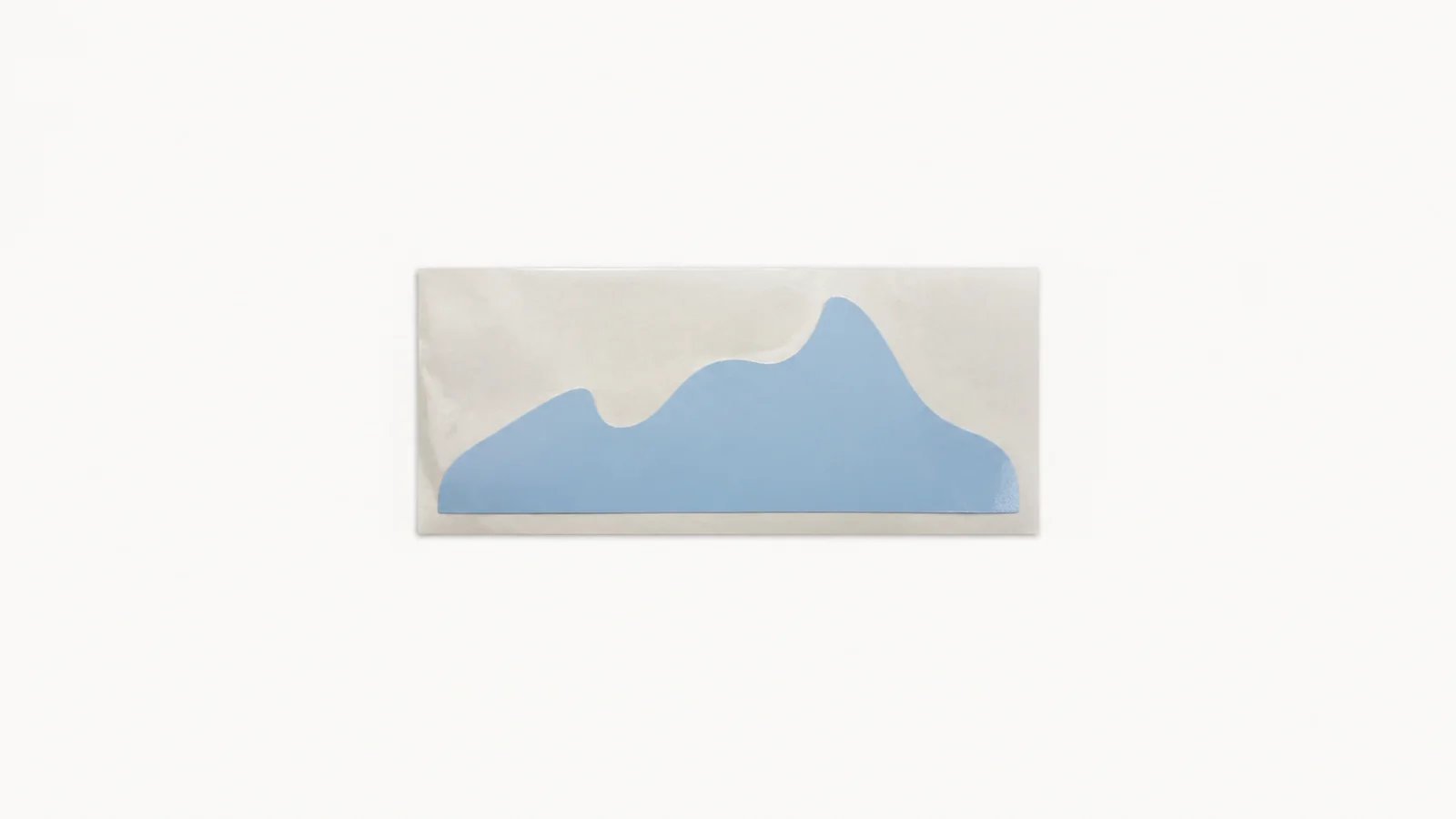 Isolated a weeded vinyl decal on a backing sheet centred on a seamless pale off-white studio background, generous empty margin on every side for overlaid branding