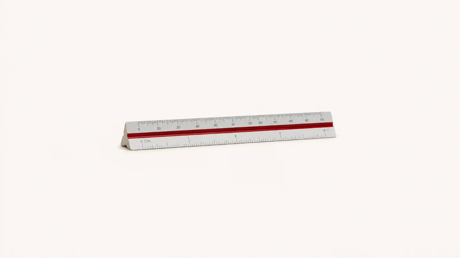Isolated a triangular engineer's scale rule with graduated faces centred on a seamless pale off-white studio background, generous empty margin on every side for overlaid branding
