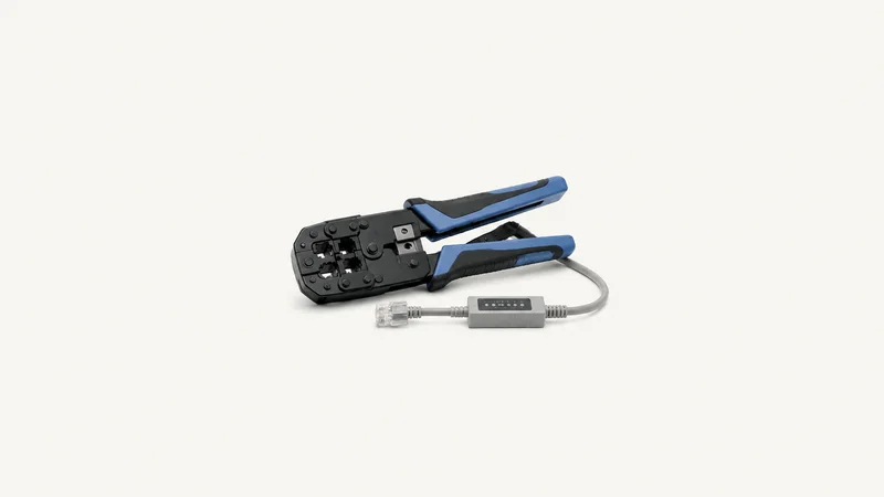 Isolated a network cable crimping tool with a test lead centred on a seamless pale off-white studio background, generous empty margin on every side for overlaid branding