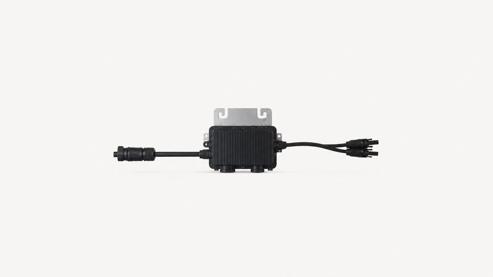 Isolated a microinverter module with its trunk cable centred on a seamless pale off-white studio background, generous empty margin on every side for overlaid branding