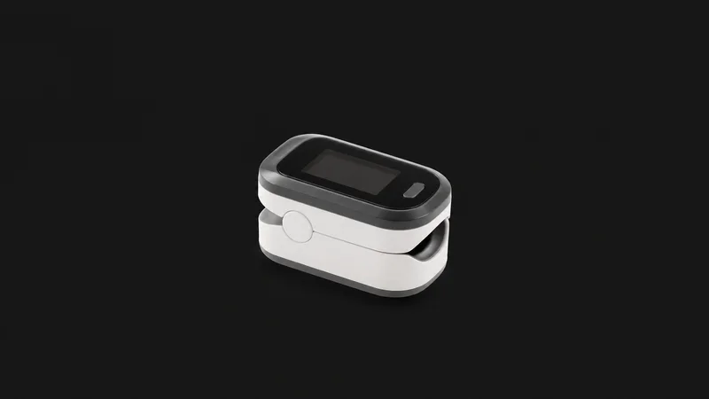 Isolated a fingertip pulse oximeter clip with a blank readout window centred on a seamless deep charcoal near-black studio background, generous empty margin on every side for overlaid branding