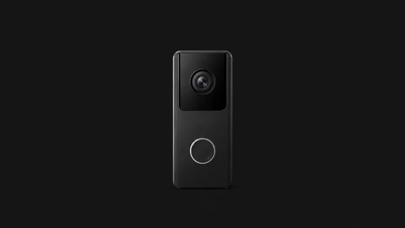 Isolated a video doorbell unit with a round lens and a blank button ring centred on a seamless deep charcoal near-black studio background, generous empty margin on every side for overlaid branding