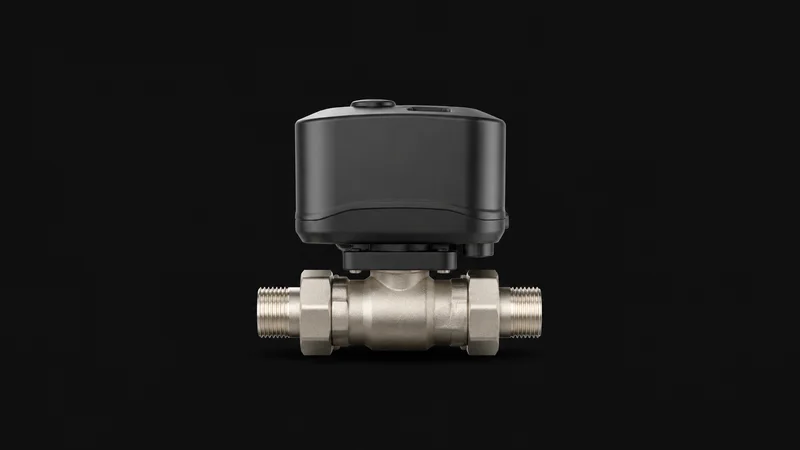 Isolated a home water-shutoff smart valve with a motorised body on a pipe section centred on a seamless deep charcoal near-black studio background, generous empty margin on every side for overlaid branding