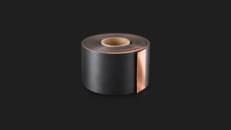 Isolated a coil of coated electrode on copper foil centred on a seamless deep charcoal near-black studio background, generous empty margin on every side for overlaid branding