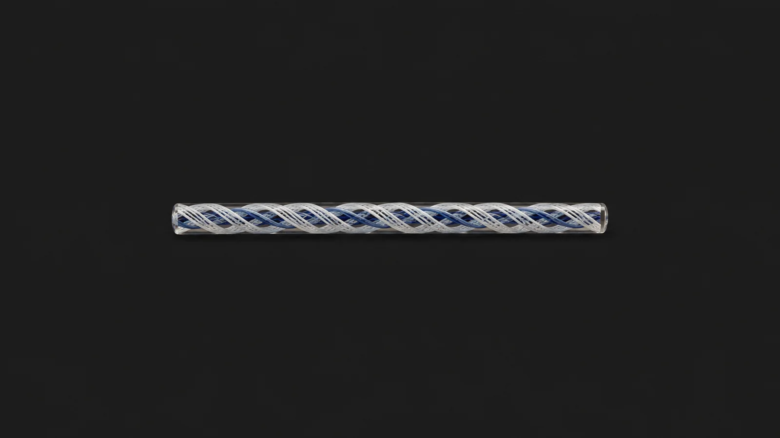Isolated a rod of coloured glass cane with a twisted latticino core centred on a seamless deep charcoal near-black studio background, generous empty margin on every side for overlaid branding