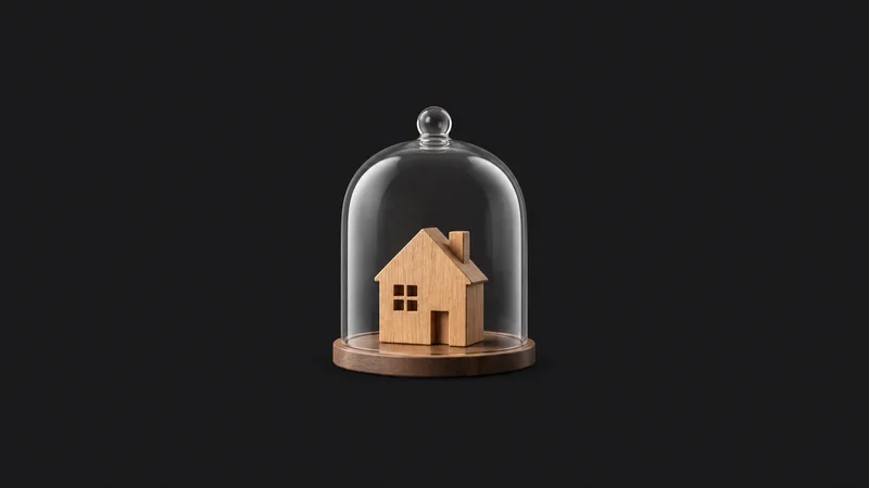 Isolated a house-shaped wooden block under a glass dome centred on a seamless deep charcoal near-black studio background, generous empty margin on every side for overlaid branding