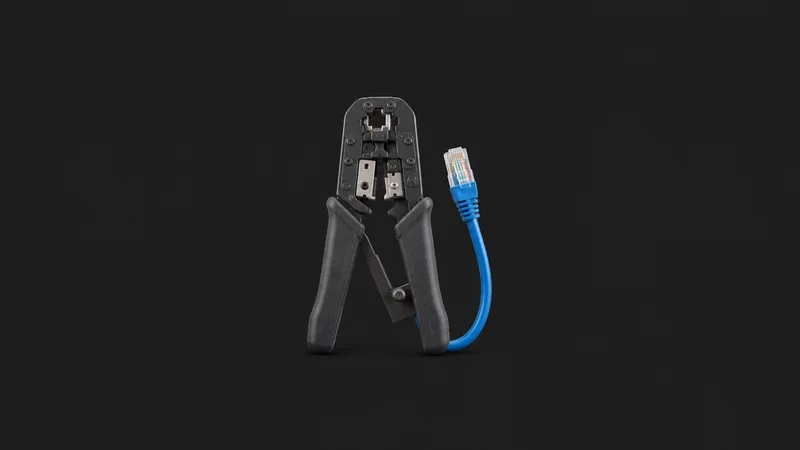 Isolated a network cable crimping tool with a test lead centred on a seamless deep charcoal near-black studio background, generous empty margin on every side for overlaid branding