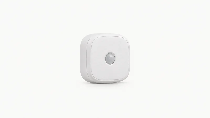 Isolated a small self-adhesive home telematics beacon in a white shell centred on a seamless pale off-white studio background, generous empty margin on every side for overlaid branding