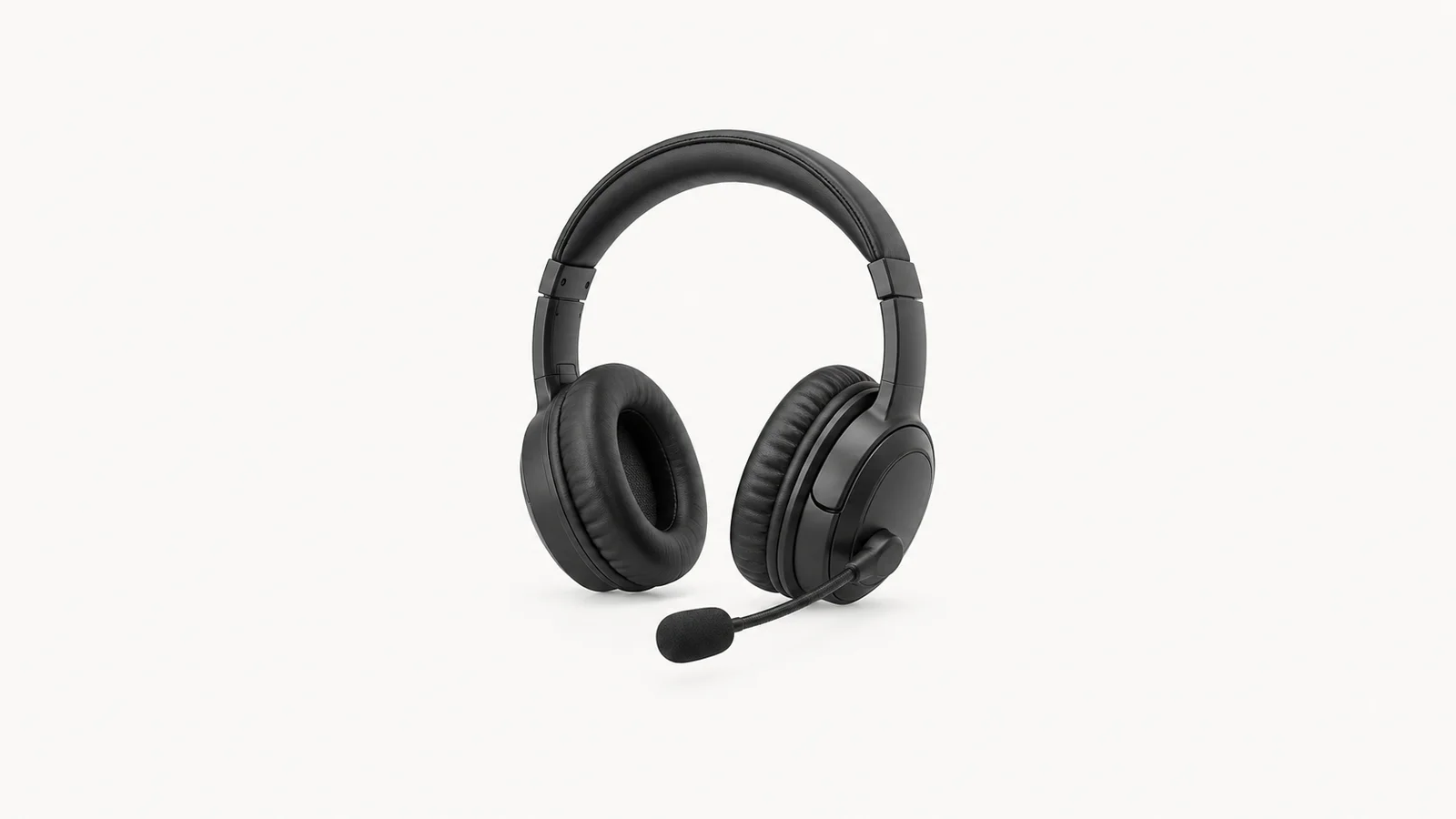 Isolated an over-ear headset with a boom microphone for language lessons centred on a seamless pale off-white studio background, generous empty margin on every side for overlaid branding