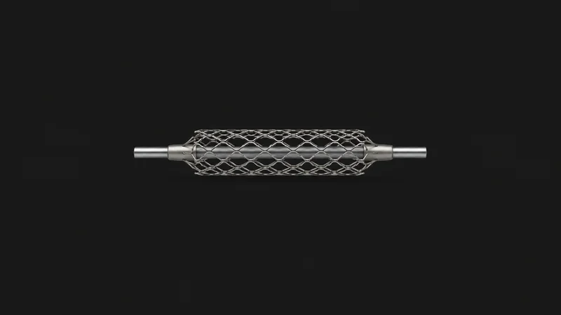 Isolated a nitinol vascular stent expanded on a mandrel centred on a seamless deep charcoal near-black studio background, generous empty margin on every side for overlaid branding