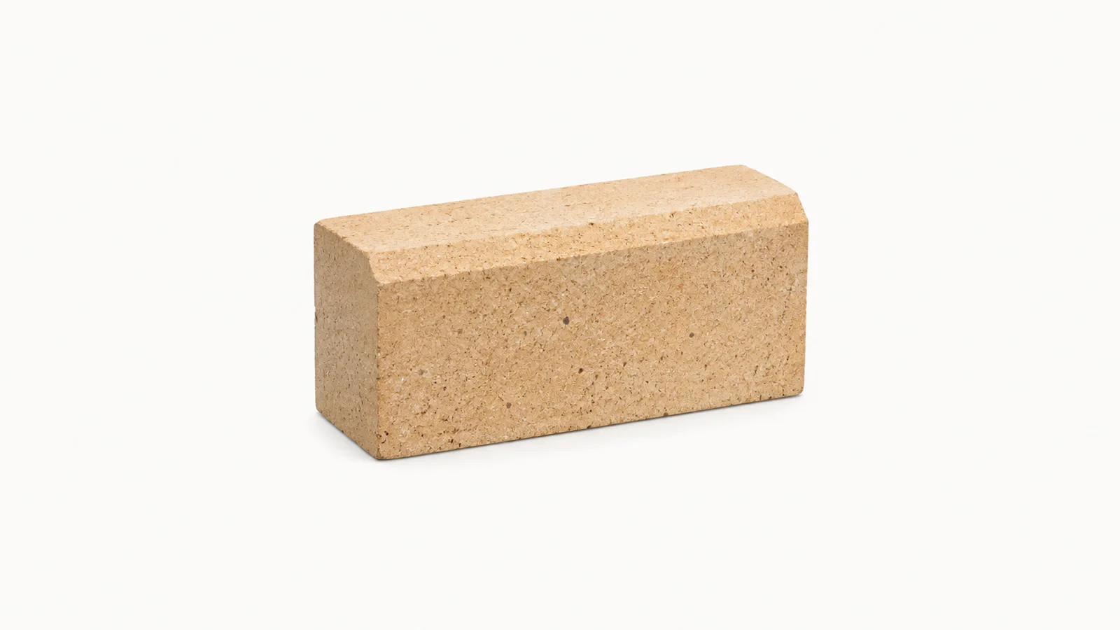 Isolated a refractory brick with a chamfered edge centred on a seamless pale off-white studio background, generous empty margin on every side for overlaid branding