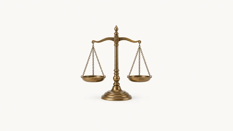 Isolated a brass balance scales of justice cast in bronze centred on a seamless pale off-white studio background, generous empty margin on every side for overlaid branding