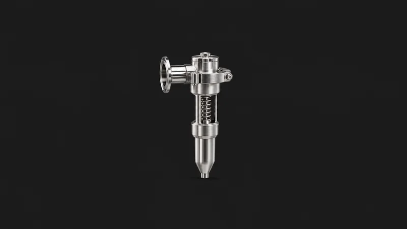 Isolated a stainless rotary filler nozzle with a spring valve centred on a seamless deep charcoal near-black studio background, generous empty margin on every side for overlaid branding
