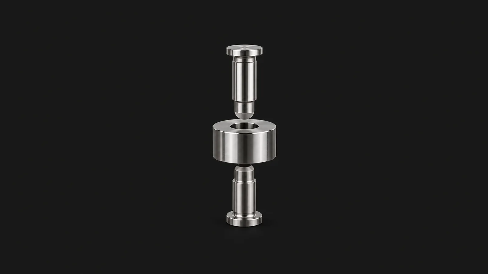 Isolated a tablet-press punch and die set in polished steel centred on a seamless deep charcoal near-black studio background, generous empty margin on every side for overlaid branding