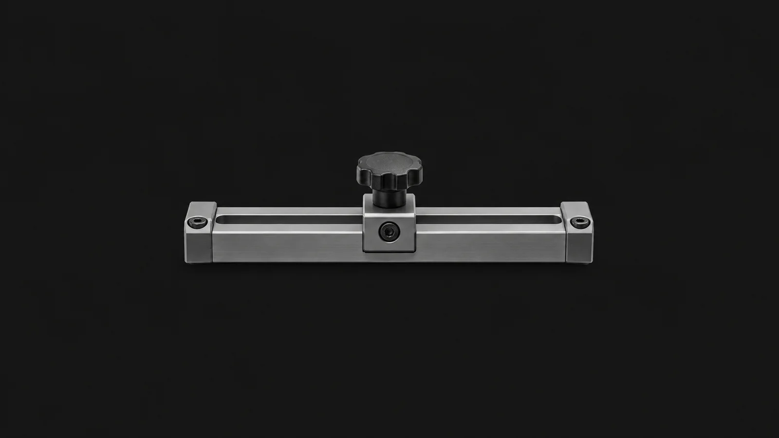 Isolated an anodised aluminium change-part rail with a locking knob centred on a seamless deep charcoal near-black studio background, generous empty margin on every side for overlaid branding