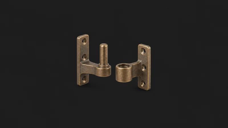 Isolated a cast-bronze rudder pintle and gudgeon pair centred on a seamless deep charcoal near-black studio background, generous empty margin on every side for overlaid branding
