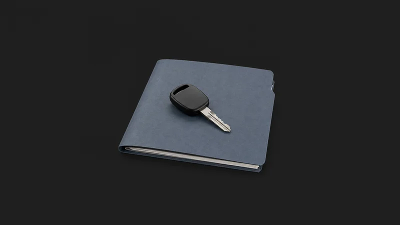 Isolated a car key resting on a folded policy folder centred on a seamless deep charcoal near-black studio background, generous empty margin on every side for overlaid branding