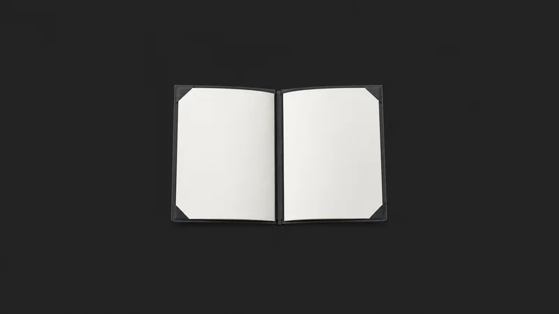 Isolated a dual-page blank document folded in a bound folder centred on a seamless deep charcoal near-black studio background, generous empty margin on every side for overlaid branding