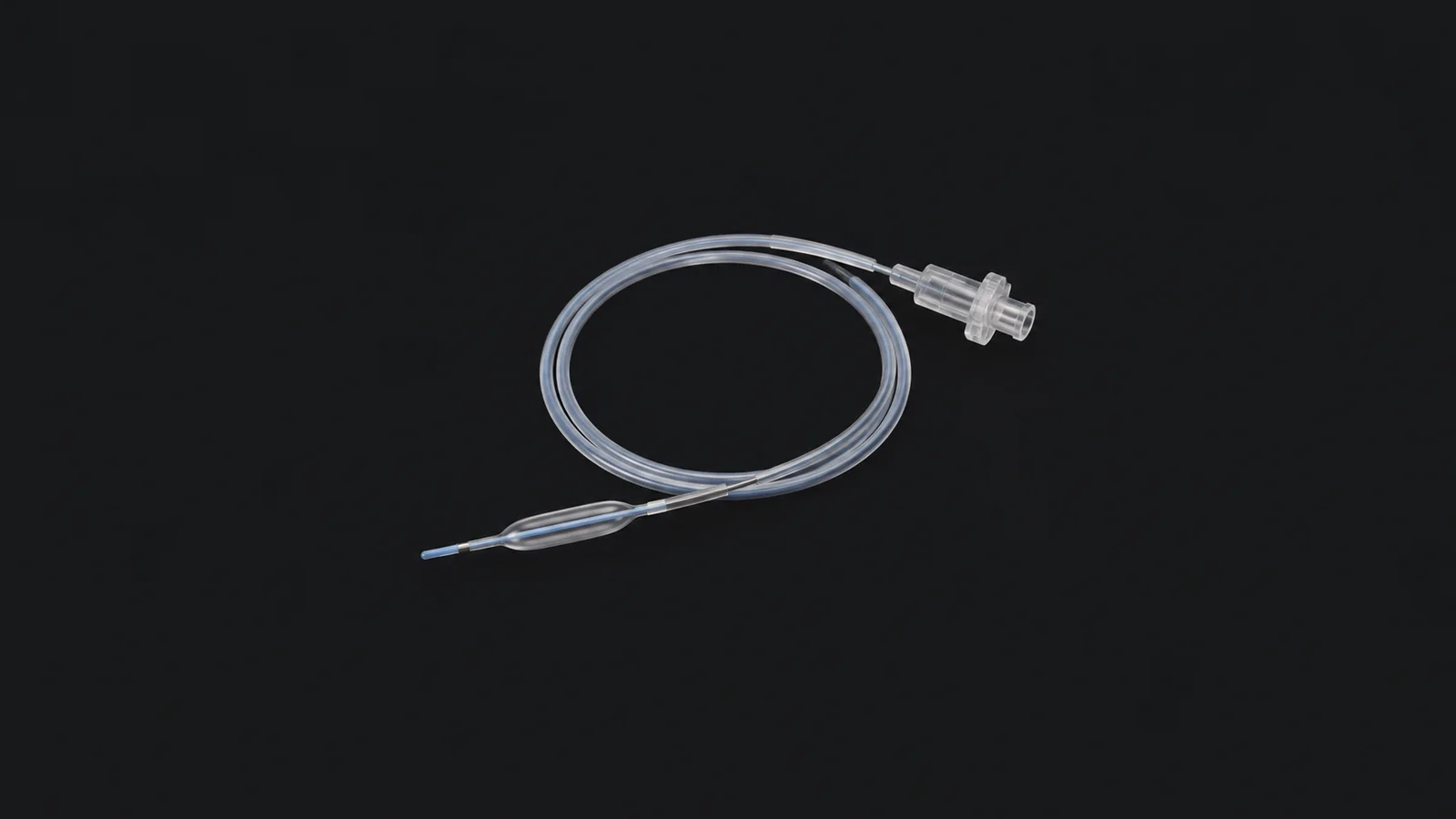Isolated a coiled balloon catheter with a luer hub centred on a seamless deep charcoal near-black studio background, generous empty margin on every side for overlaid branding